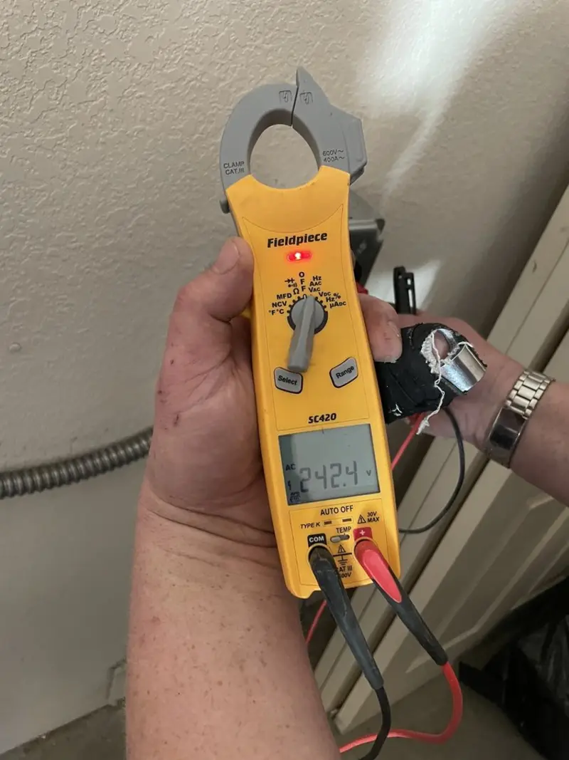 Voltage testing with clamp meter during Recessed Lighting Installation in Oglesby